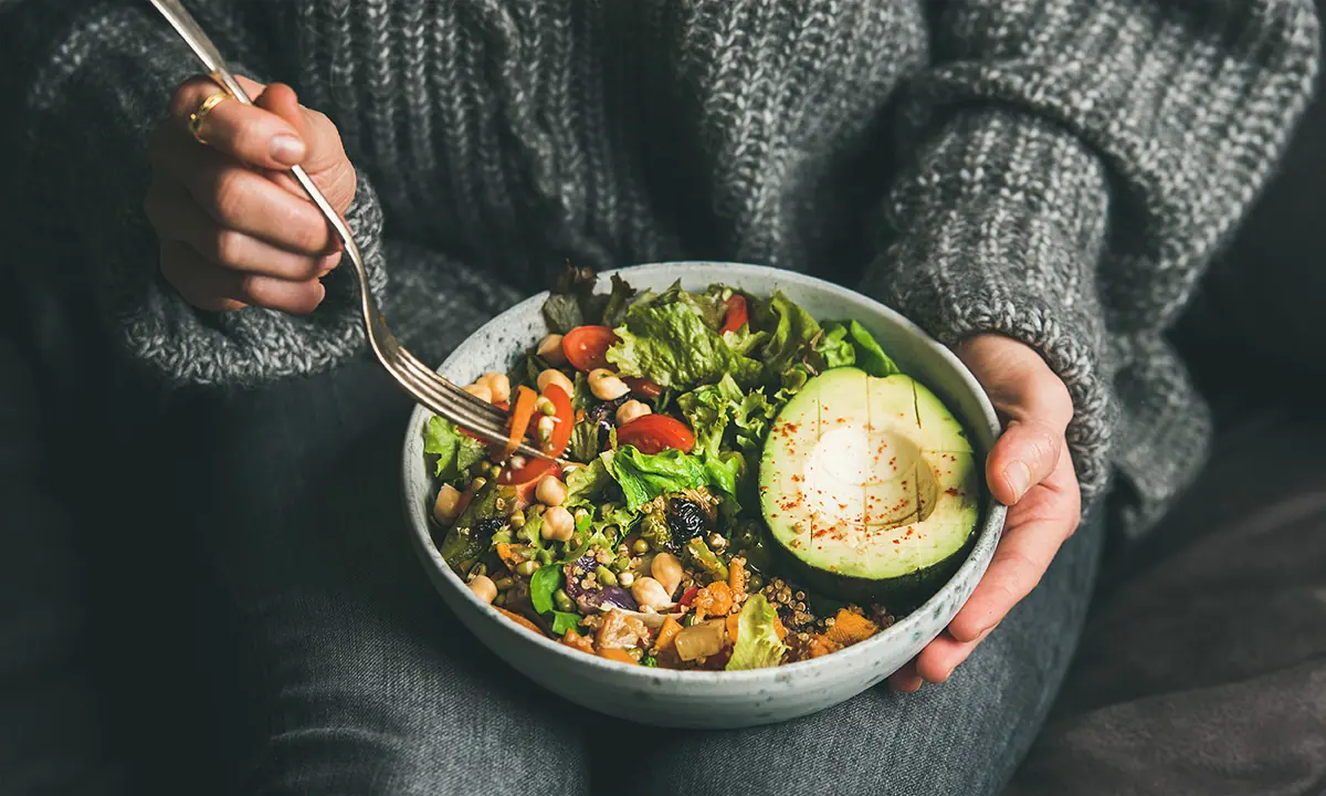 woman showing how to get the healthy nutrients that women need