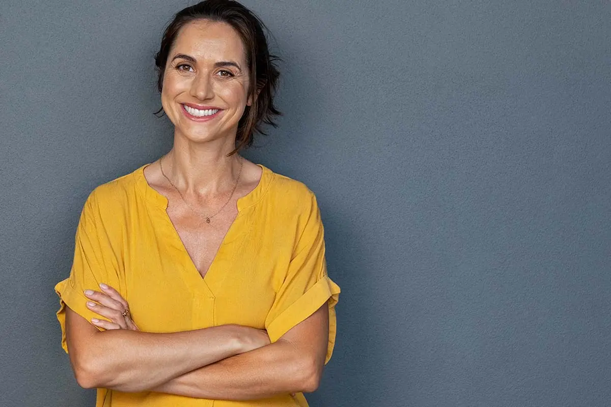 a woman is happy about being a sober woman