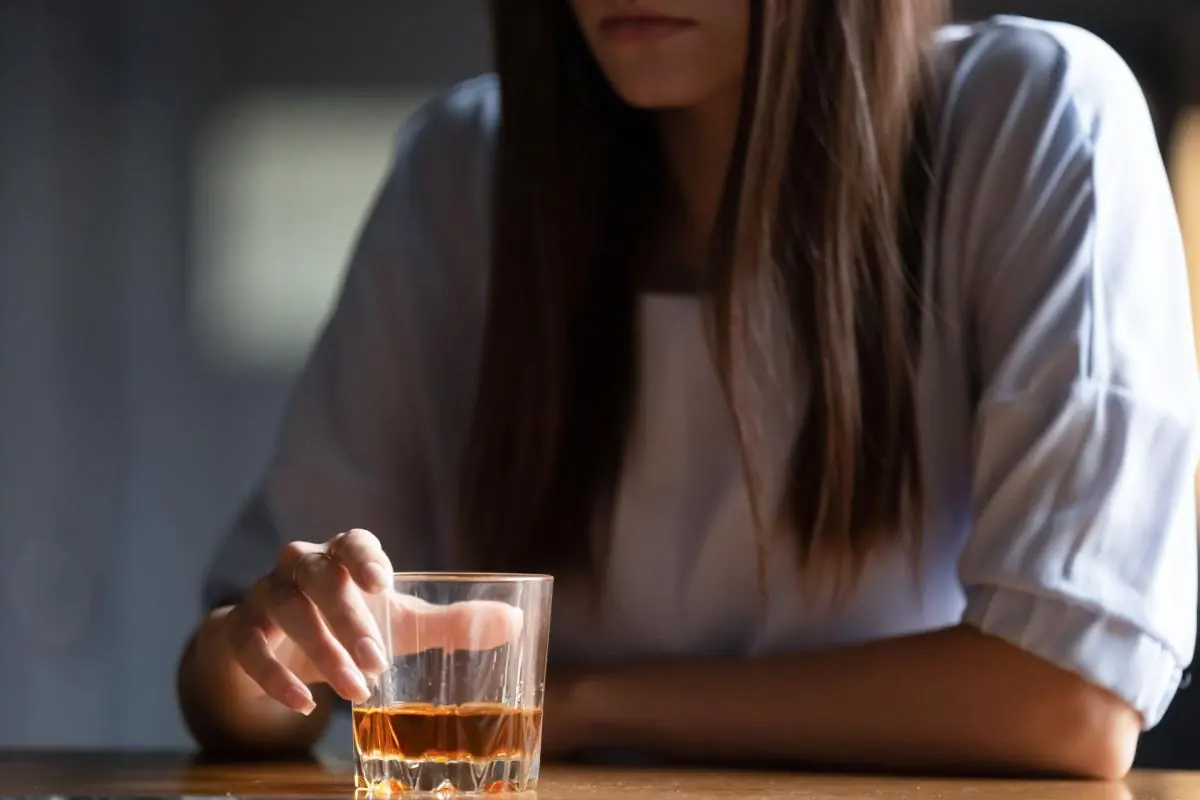 Woman suffering from both alcohol and depression
