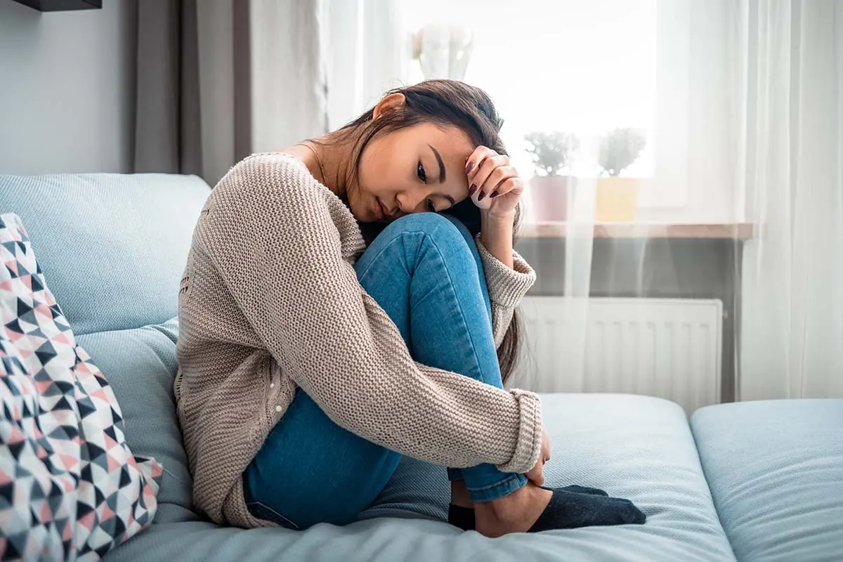 tired and hungover young woman learning how alcohol affects physical appearance of women