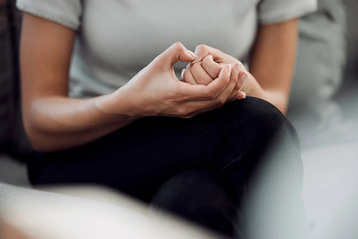 woman nervously fidgeting with her hands wondering can I use Rivotril for anxiety?