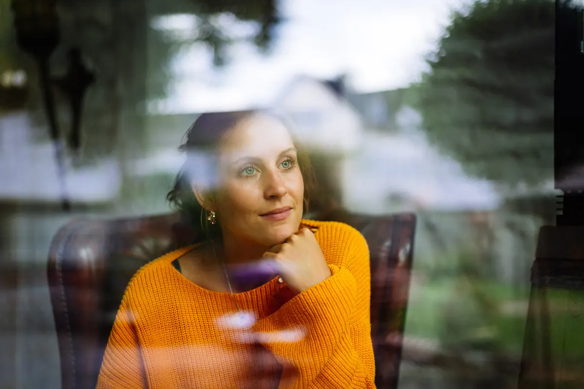 Woman looking out window