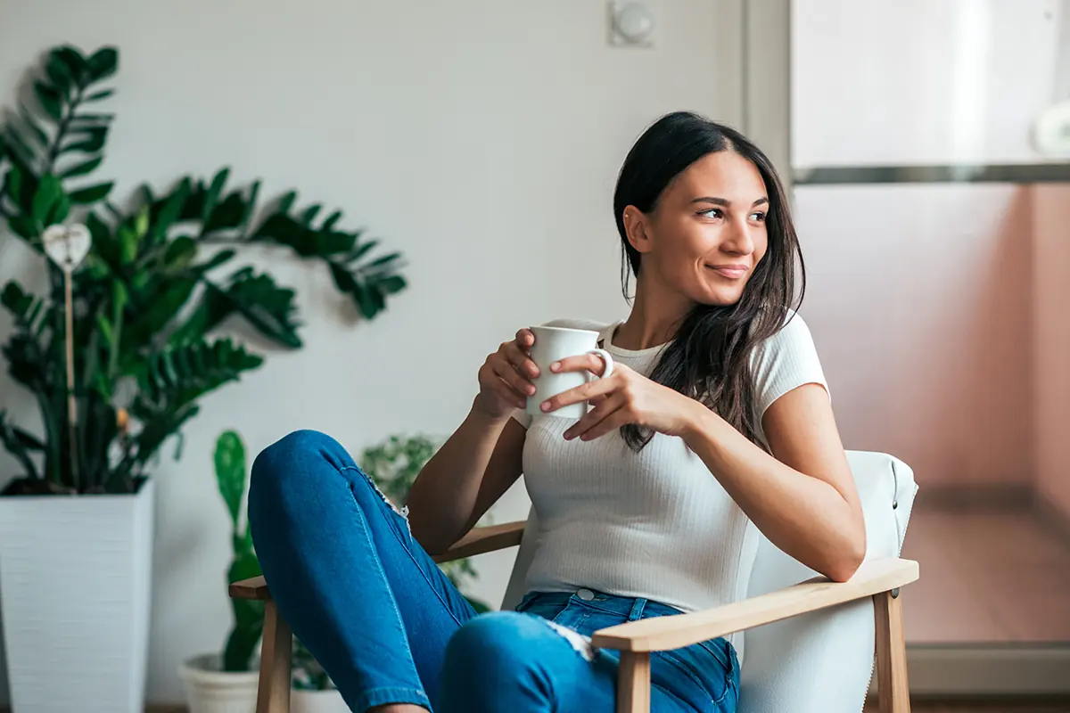 a woman smiles as she thinks about the benefits of outpatient treatment