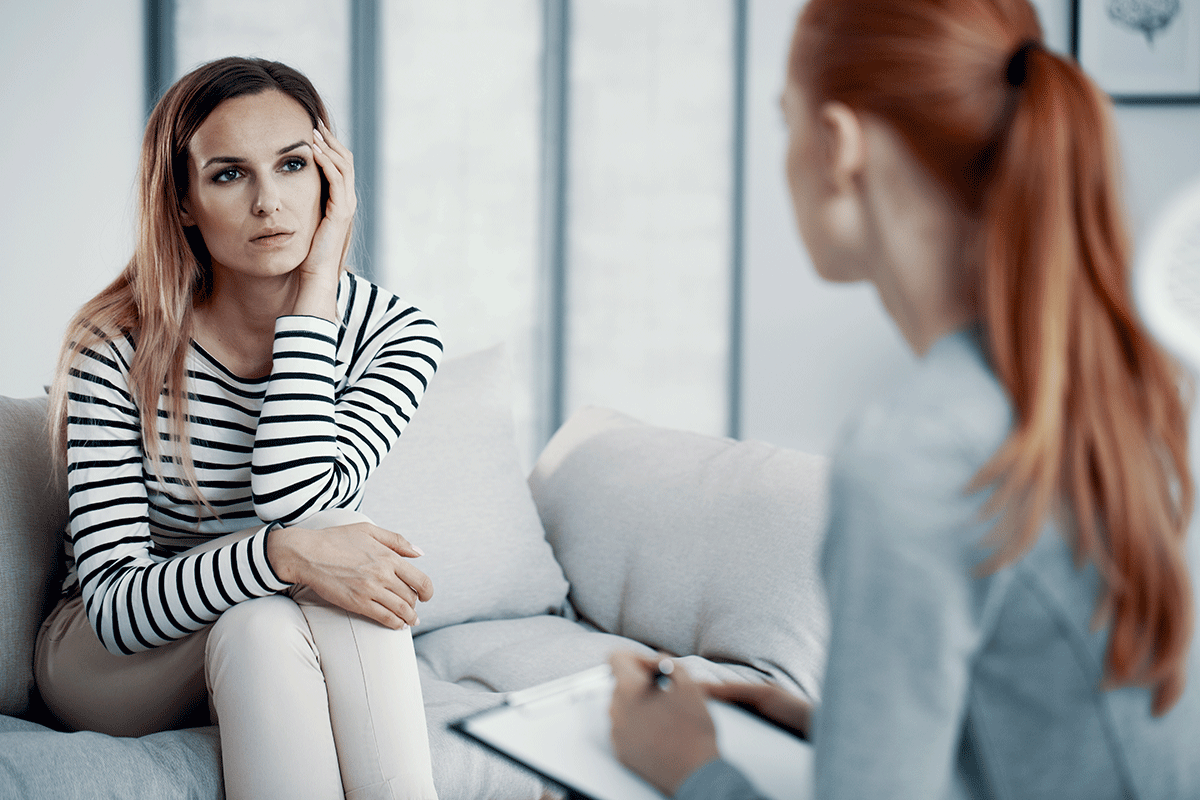 What-Is-The-Best-Treatment-For-Meth-Addiction a woman discusses her meth addiction treatment options with a specialist after entering womens rehab
