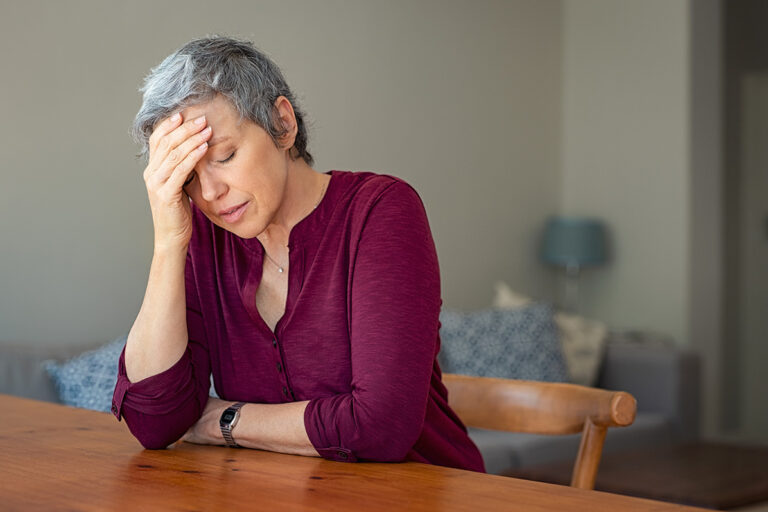 woman thinking about the alcohol hepatitis risk at a treatment center
