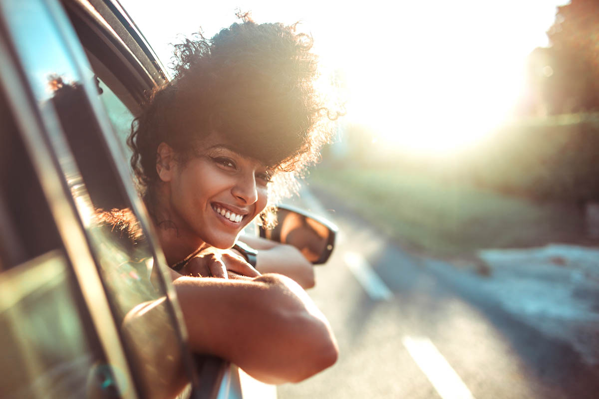 Keeping Your Sobriety on Summer Vacations a woman is happy to be on her sober vacation