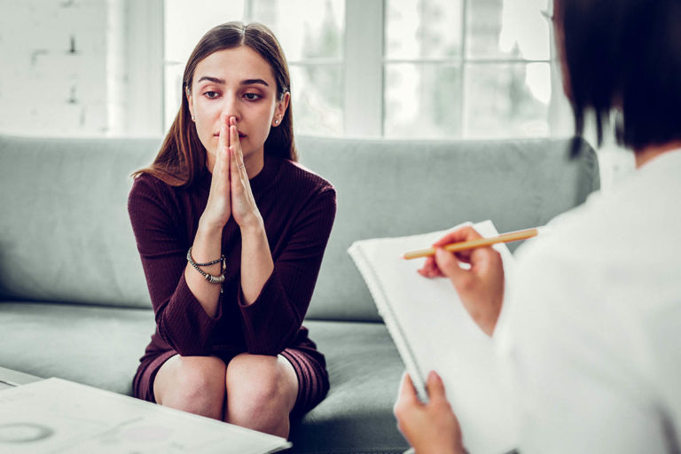 Understanding Your Past Traumas and Their Role in Addiction a woman works through issues in trauma treatment