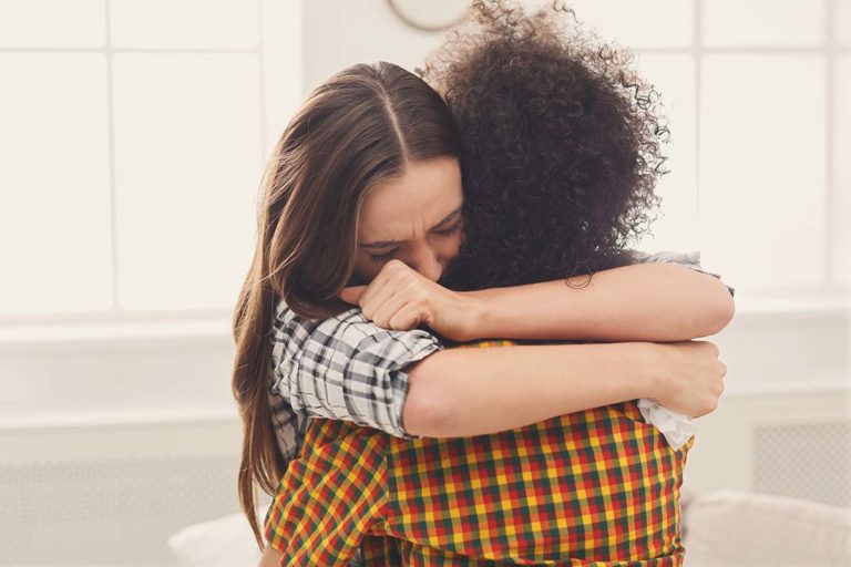 two women hug on world suicide prevention day