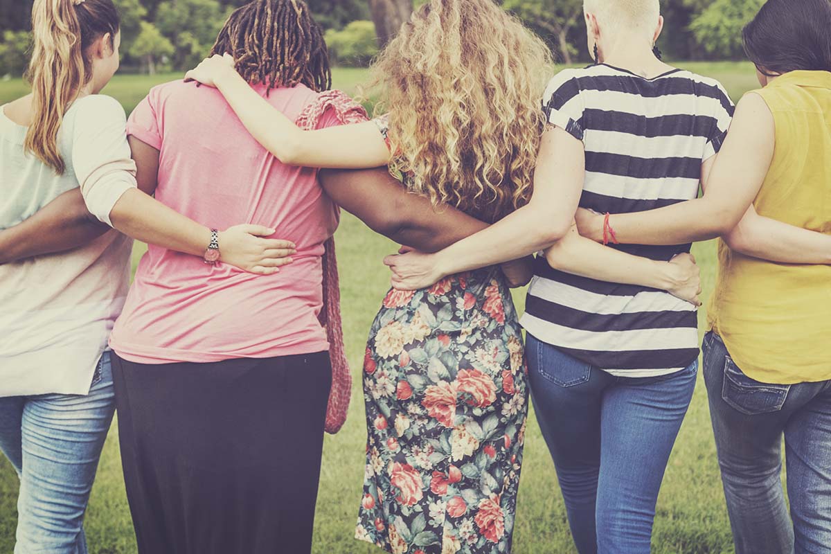 Women Female Feminism Lady Madam Friends Concept a group hugs in their sober homes for women
