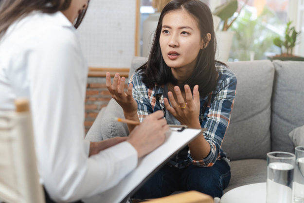 Making Your Own Relapse Prevention Plan young woman discussing relapse prevention plan with therapist