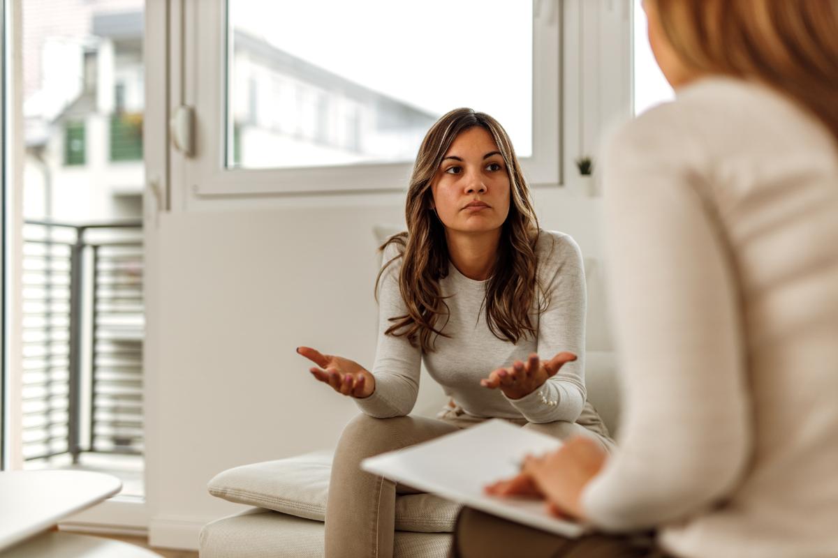 How Can an Outpatient Alcohol Rehab Program Help You_ a woman talks to a therapist during outpatient alcohol rehab