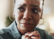 woman looks at counselor while learning about how PTSD and addiction are linked in women